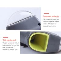 Beckett pet treat launcher showing a handheld device with treats ready to be launched for pets.
