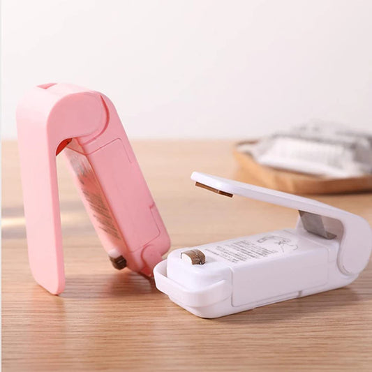 Ignisio Mini Heat Sealer with compact design, handheld device for sealing plastic bags and food storage, close-up view.