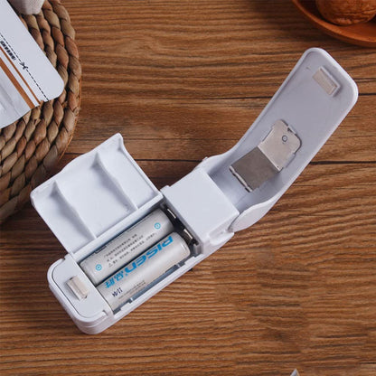 Ignisio mini heat sealer with compact design, showing the sealing bar and control buttons on a white background.
