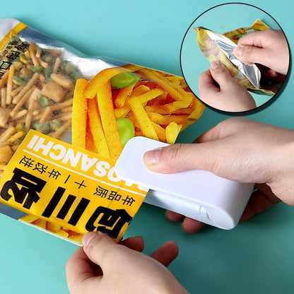 Ignisio mini heat sealer with black handle and sealing strip, compact device for plastic bag sealing on a white background