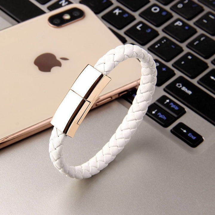 Beckett charging bracelet with sleek black band and integrated charging port, designed for portable device charging on the go.