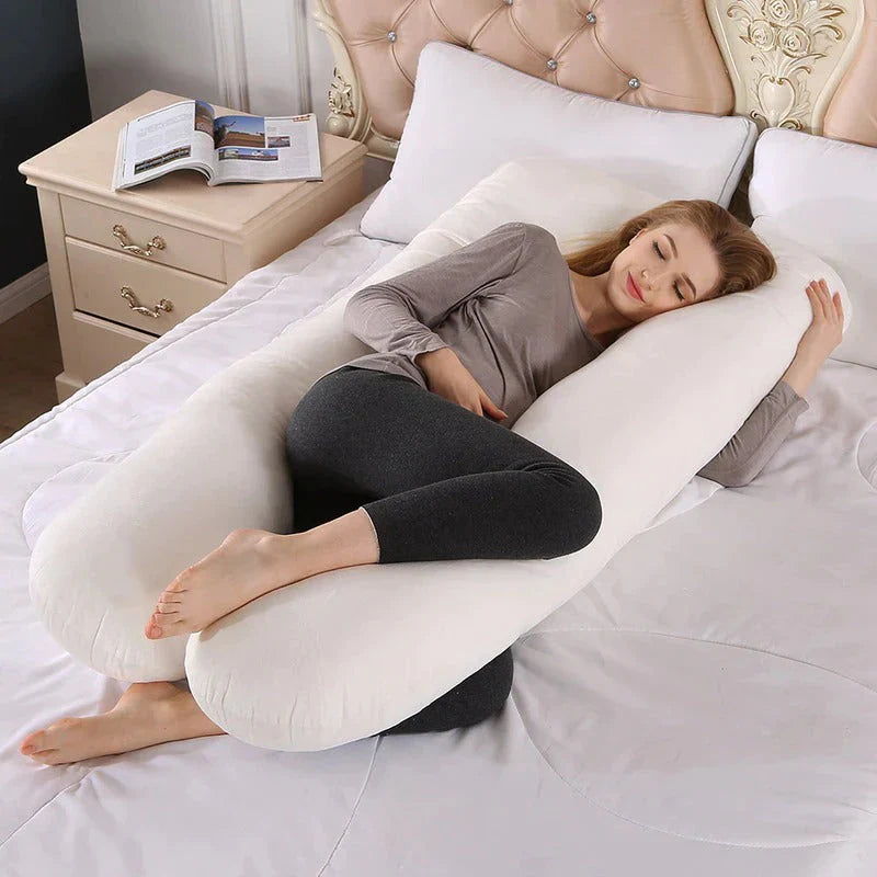 Beckett sleep therapy pillow in white, designed for pregnancy support, featuring a soft, ergonomic shape for comfortable rest.