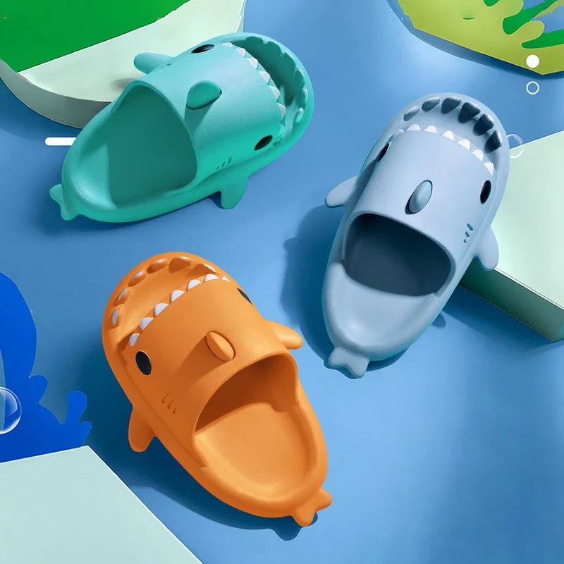 Beckett Shark slides featuring black and white design with shark graphic, open-toe casual footwear for summer.