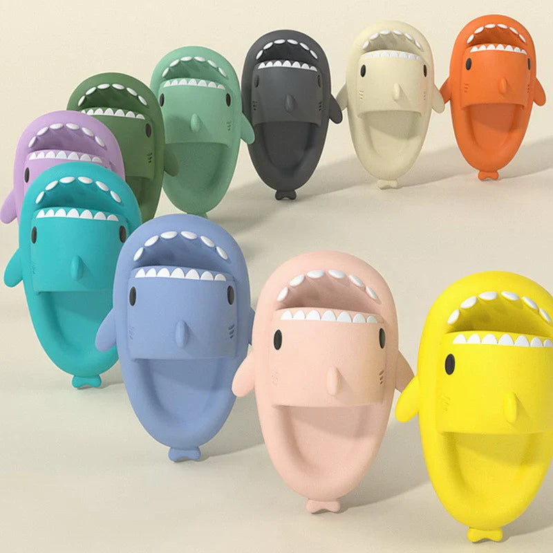 Beckett Shark slides featuring black design and shark logo, casual open-toe slide sandals for comfortable summer wear.