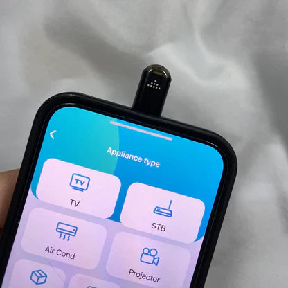 Beckett infrared phone adapter connected to smartphone for wireless data transfer and device compatibility.