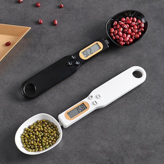 Beckett LCD digital kitchen scale with spoon, featuring a clear display and stainless steel surface for precise measurement.