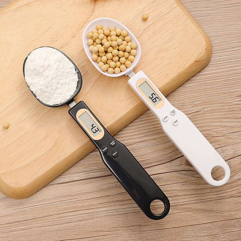 Beckett LCD digital kitchen scale with spoon, featuring a clear digital display and stainless steel spoon for precise measurements.