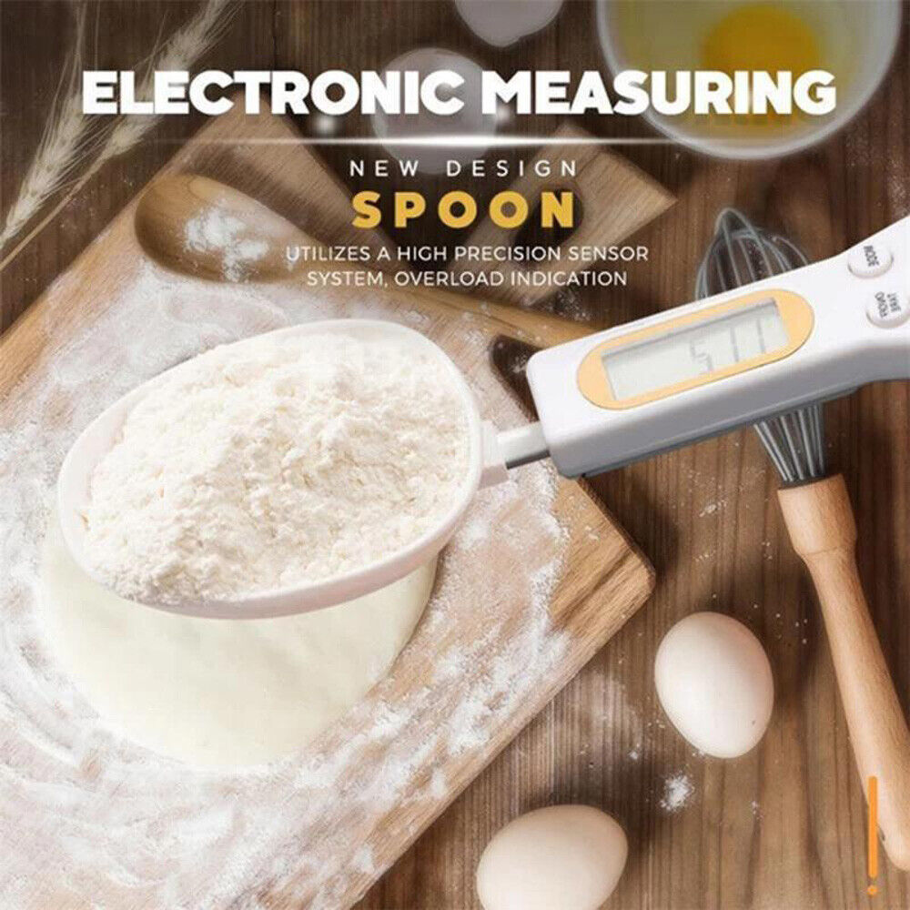 Beckett LCD digital kitchen scale with spoon, featuring a clear digital display and stainless steel measuring surface.
